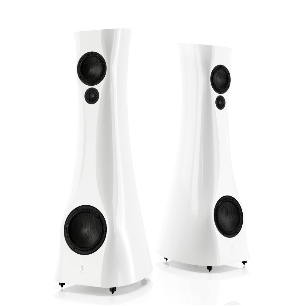 A pair of White Gloss Estelon XB MK II reference speakers with a curved-sculptural design, standing in a reflective environment.