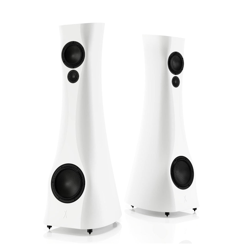 A pair of White Matte Estelon XB MK II reference speakers with a curved-sculptural design, standing in a reflective environment.