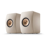 A pair of KEF LS50META Bookshellf Monitors in mineral white finish on a white background.