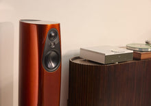 Linn 343 floor-standing speaker in a rich reddish-brown finish, with three visible drivers and a sleek curved cabinet.