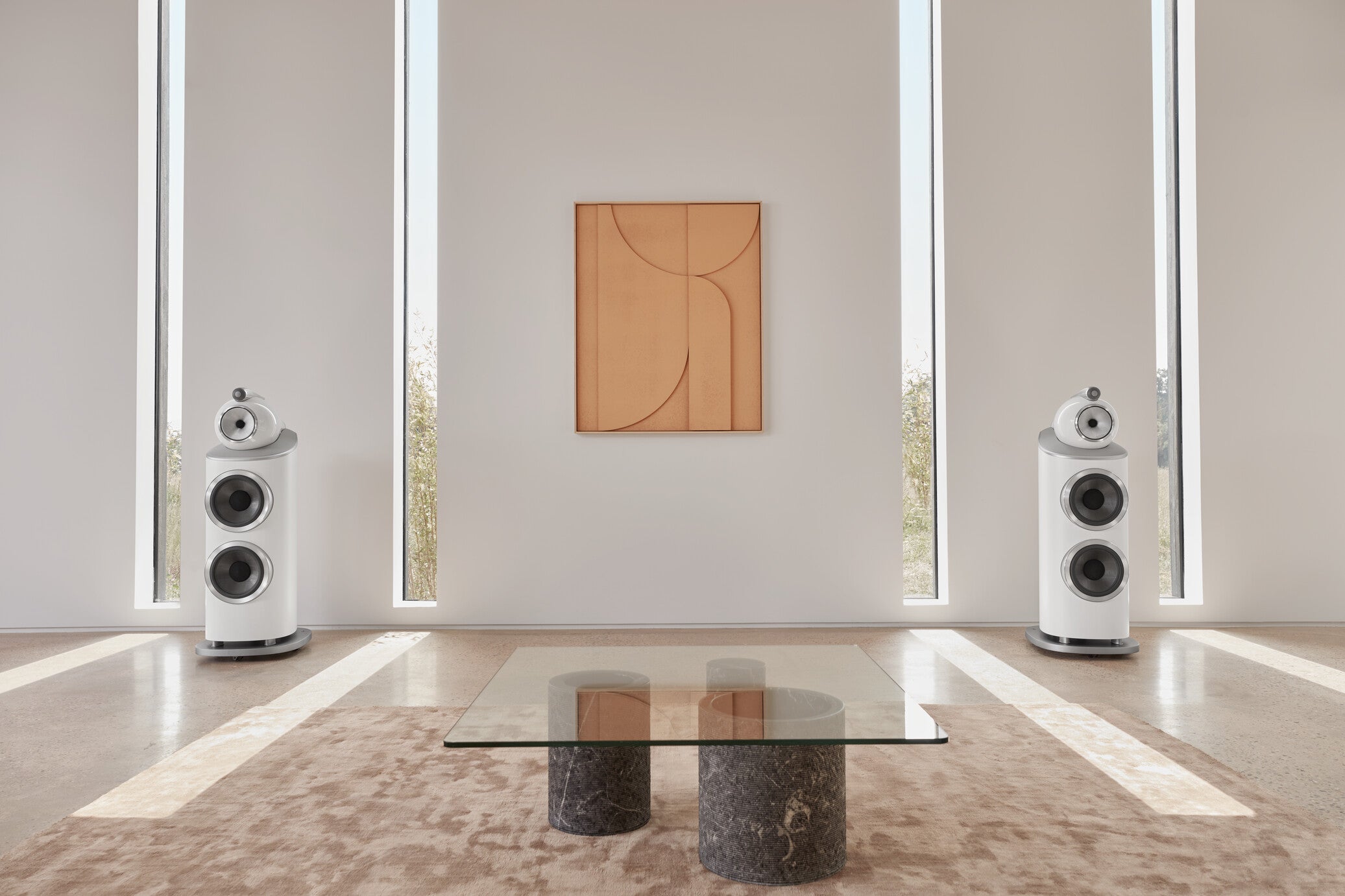 A pair of B&W 801 D4 Reference Speakers in satin white finish in a modern living room.