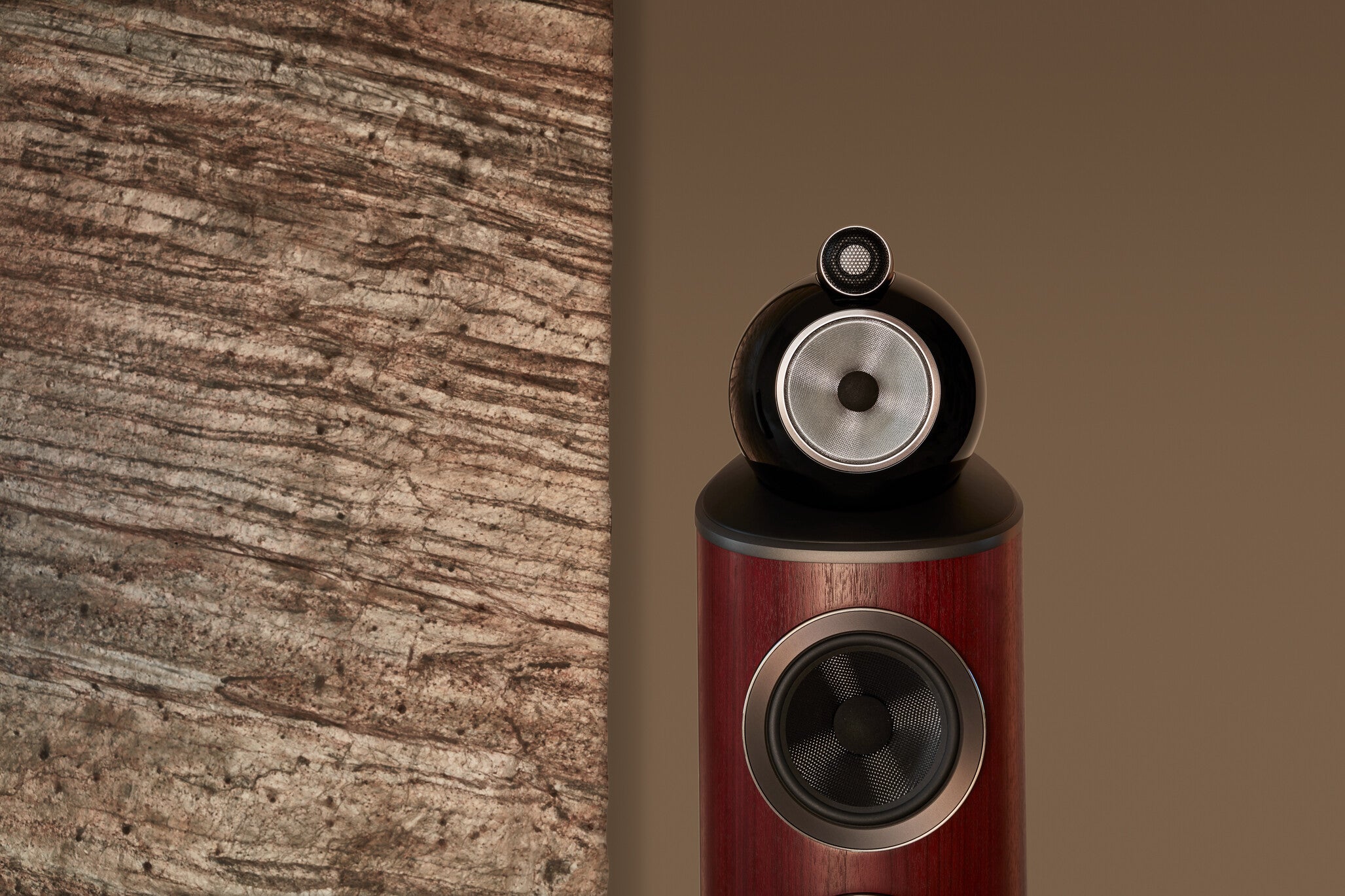 A closeup on the top of B&W 803 D4 Reference Speaker in rosenut color finish.