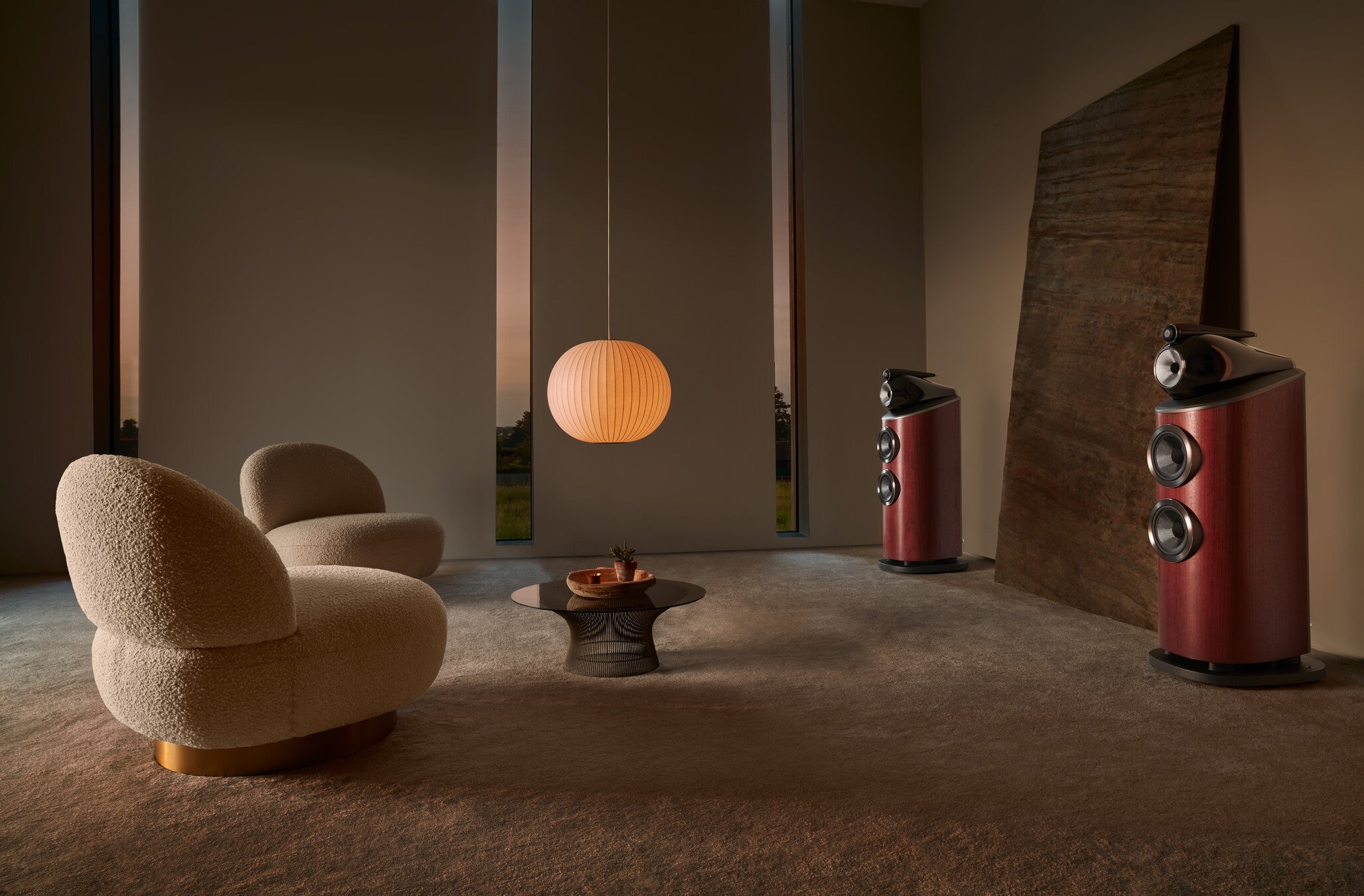 A pair of B&W 803 D4 Reference Speaker in rosenut finish in a modern living room.