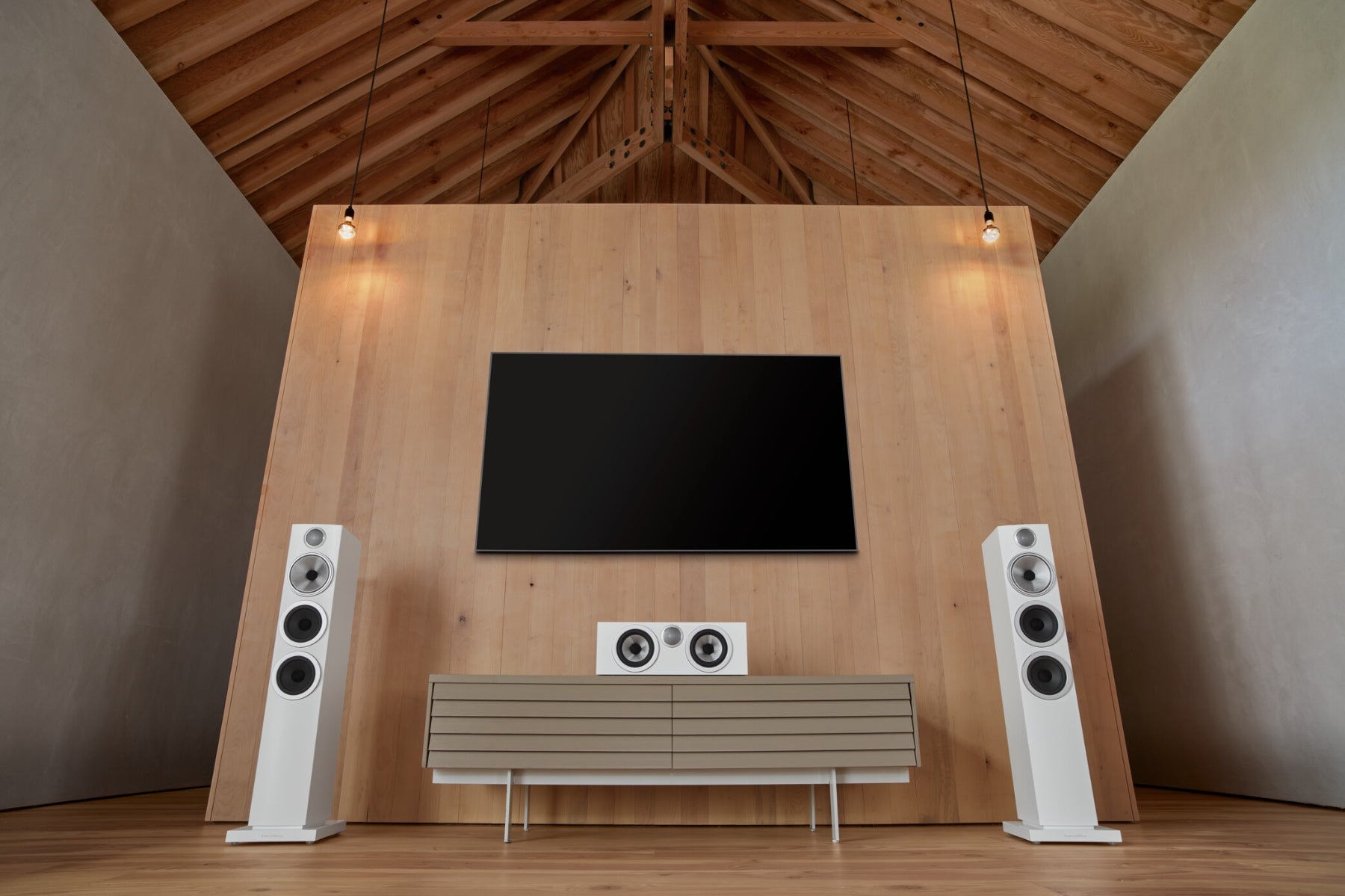 A modern home theatre featuring B&W 704 S3 Floor Standing Speakers.