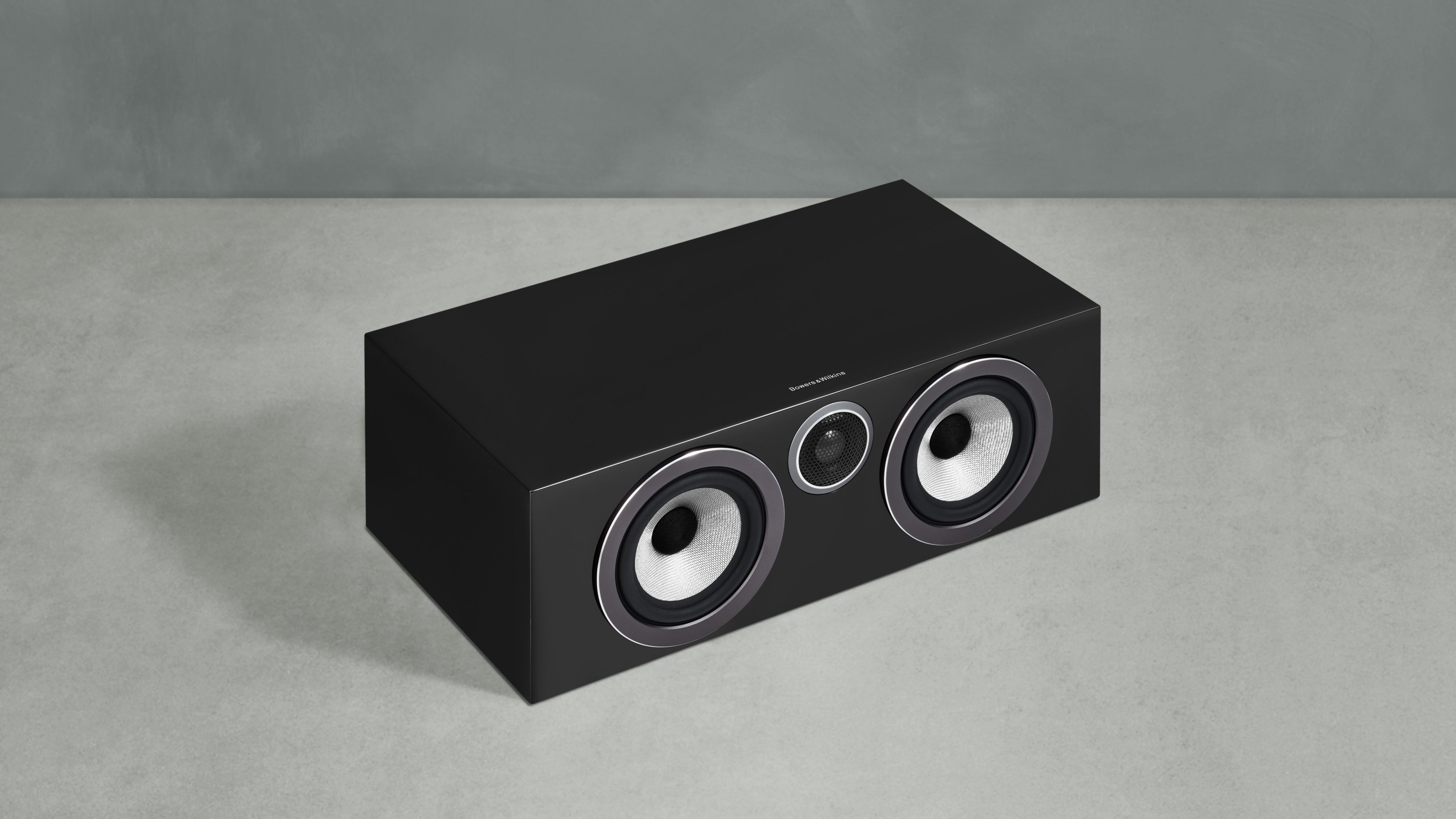 A B&W HTM72 S3 Centre Channel speaker in black color from to top right angle.