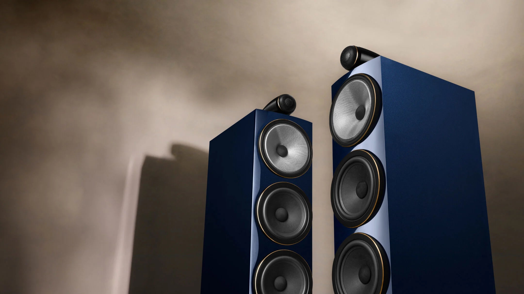 A closeup on a pair of B&W 702 S3 Signature speakers in midnight blue metallic finish.