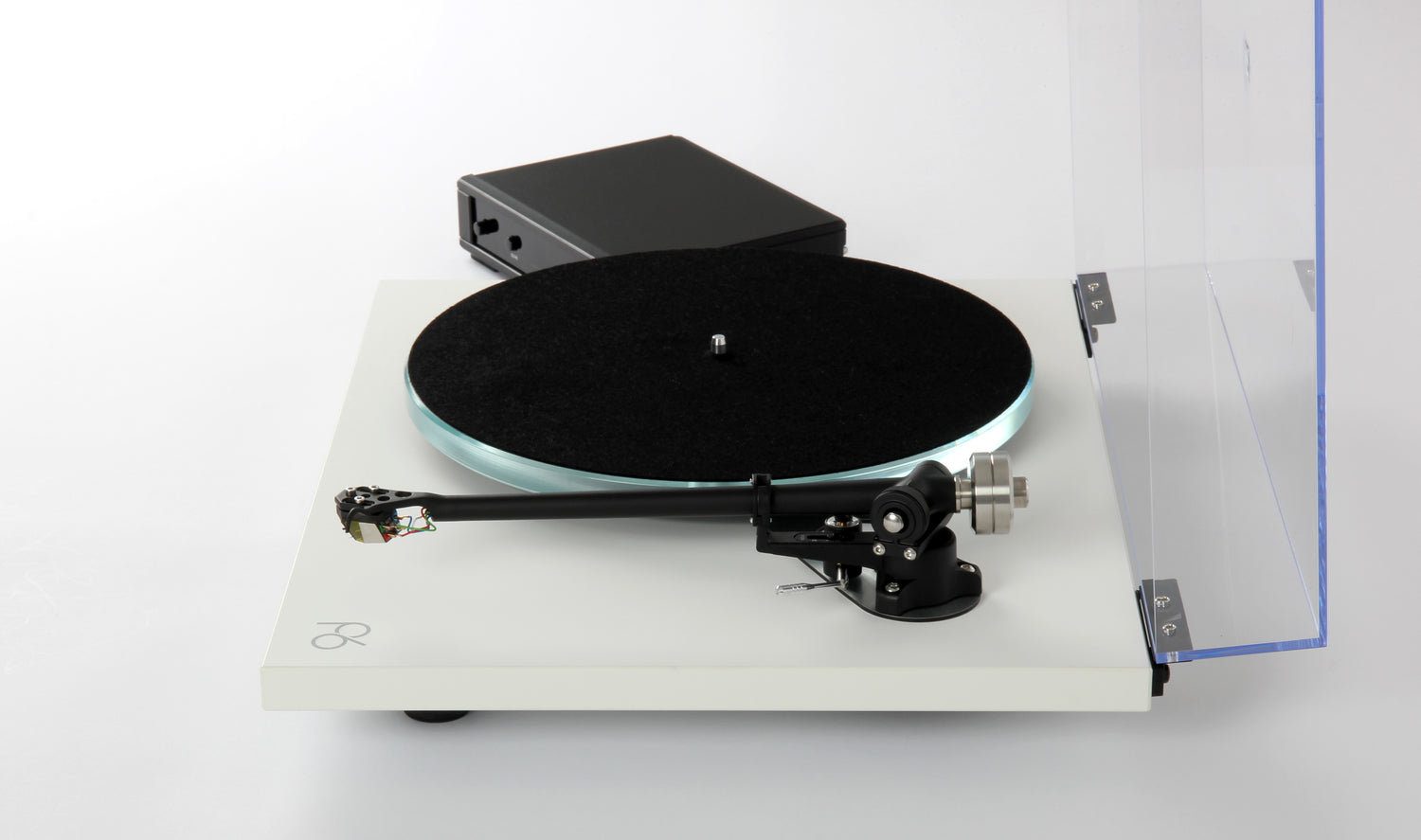 White Rega Planar 6 turntable with black platter mat, tonearm, and transparent dust cover raised.