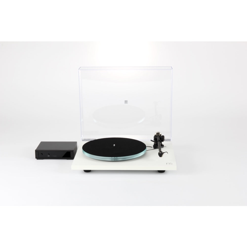 White Rega Planar 6 turntable with black platter and transparent dust cover, includes black external power supply unit.