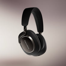 Black Bowers & Wilkins PX8 S2 Wireless headphones with brand logo on a gradient background