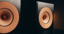 Close-up of a KEF Reference 1 Meta speaker with a focus on the cone and voice coil.