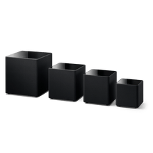 A lineup of KEF KUBE MIE Subwoofers
