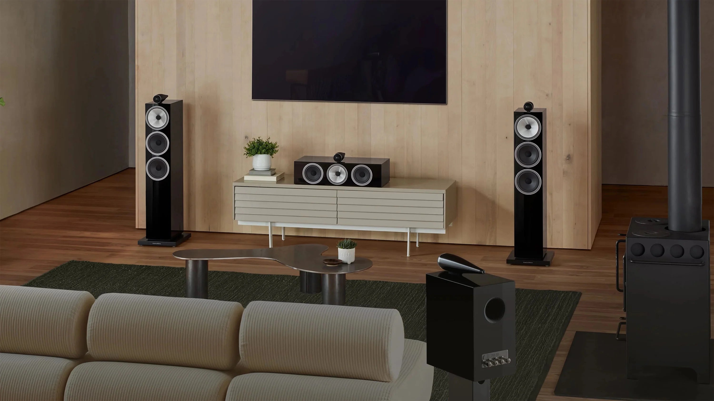 B&W 703 S3 Floor Standing Speaker in a modern home theater.