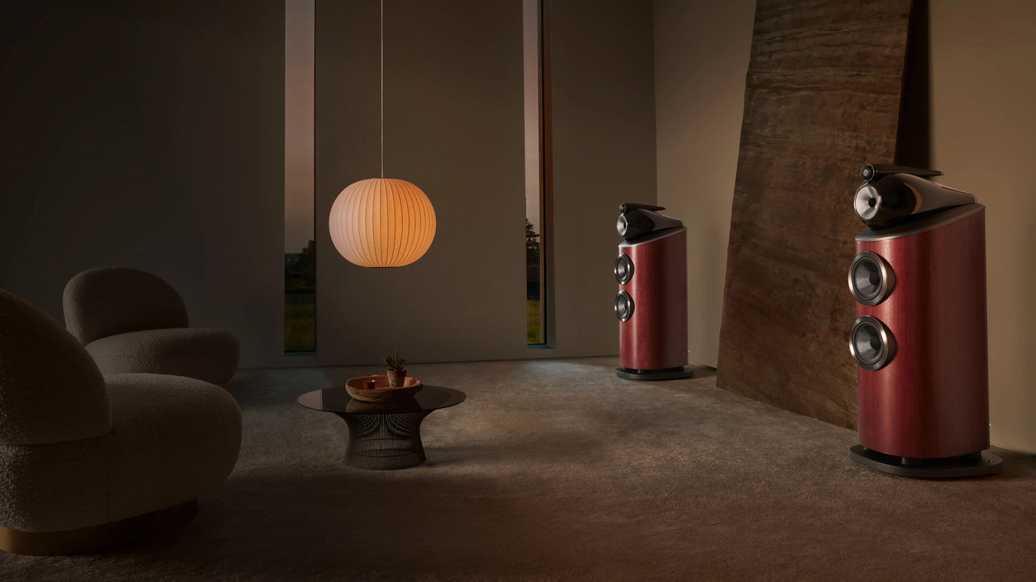 A pair of B&W 803 D4 Reference Speakers in rosenut finish in a modern living room.