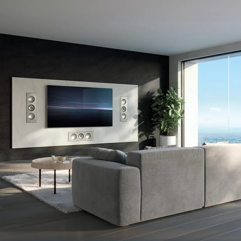 Modern living room with a gray sofa, television, and Ci3160RLM speakers installed.