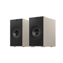 Beige KEF Coda W Powered Speakers.