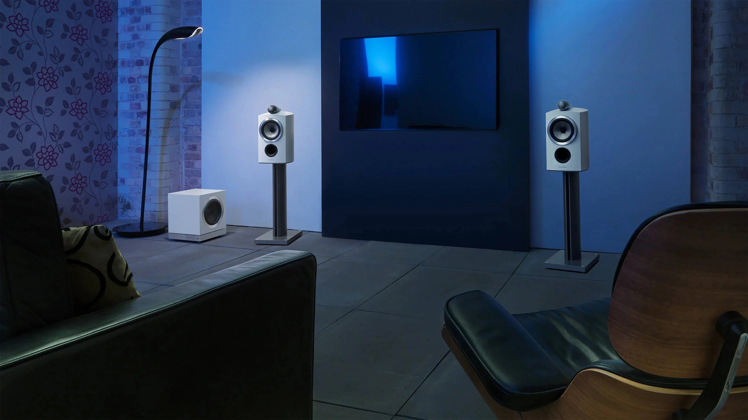 Home theater setup with B&W DB3D Dual 8” Subwoofer and speakers in a dimly lit room.