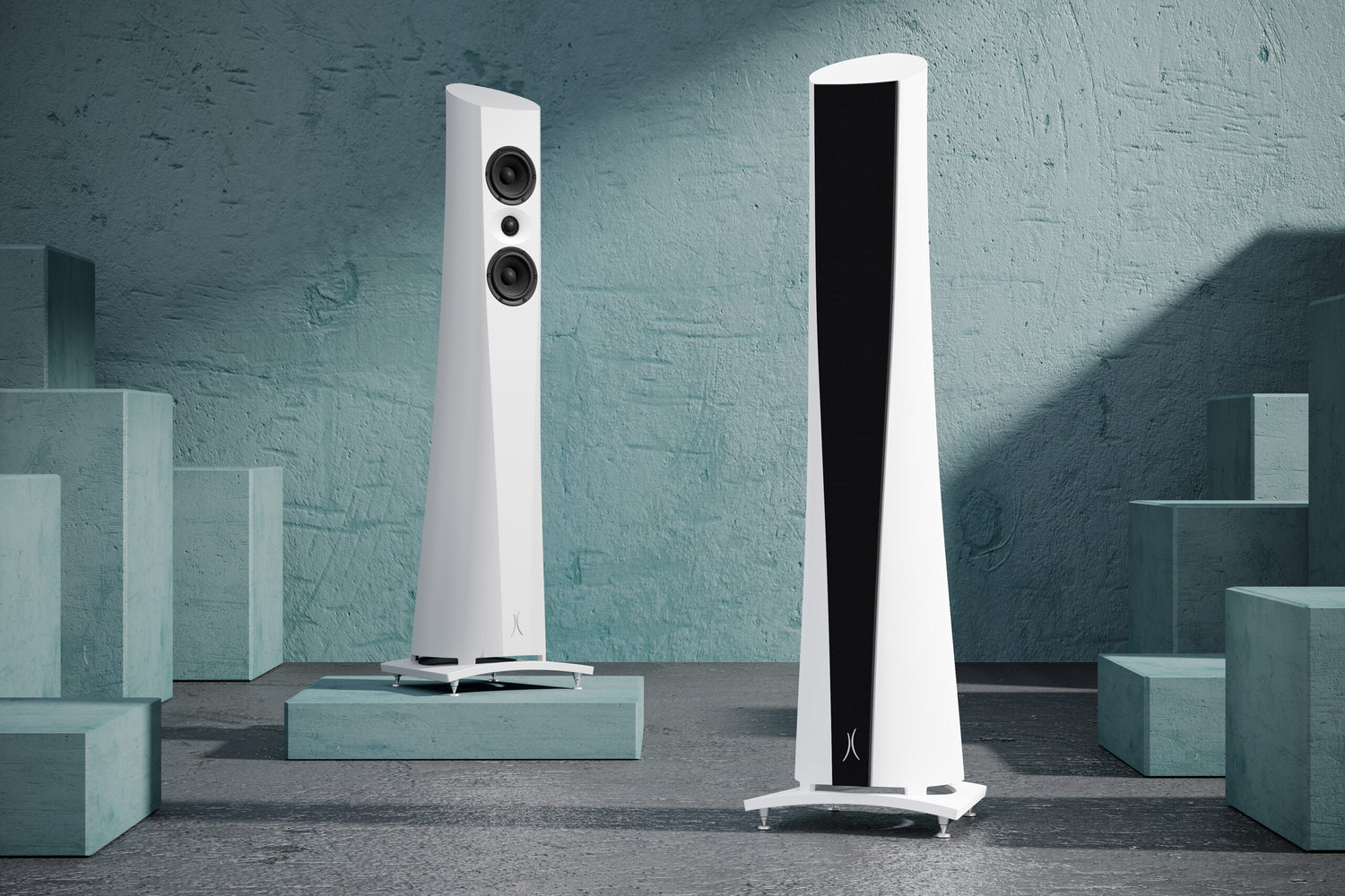 An Estelon white Aura Floor Standing Speaker with a white front and black base, featuring a minimalist design on a modern background.