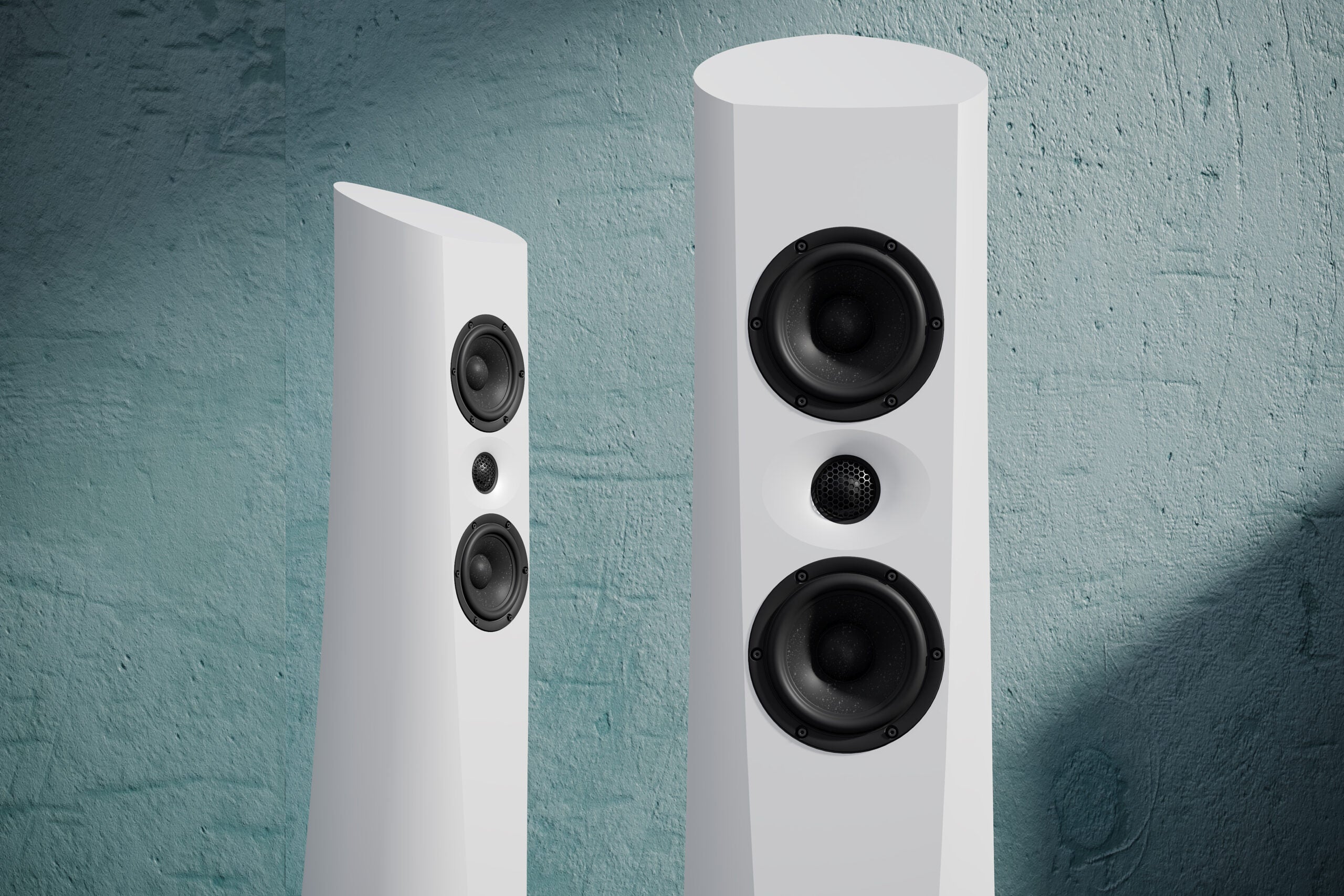 An Estelon white Aura Floor Standing Speaker with a white front and black base, featuring a minimalist design on a modern background.
