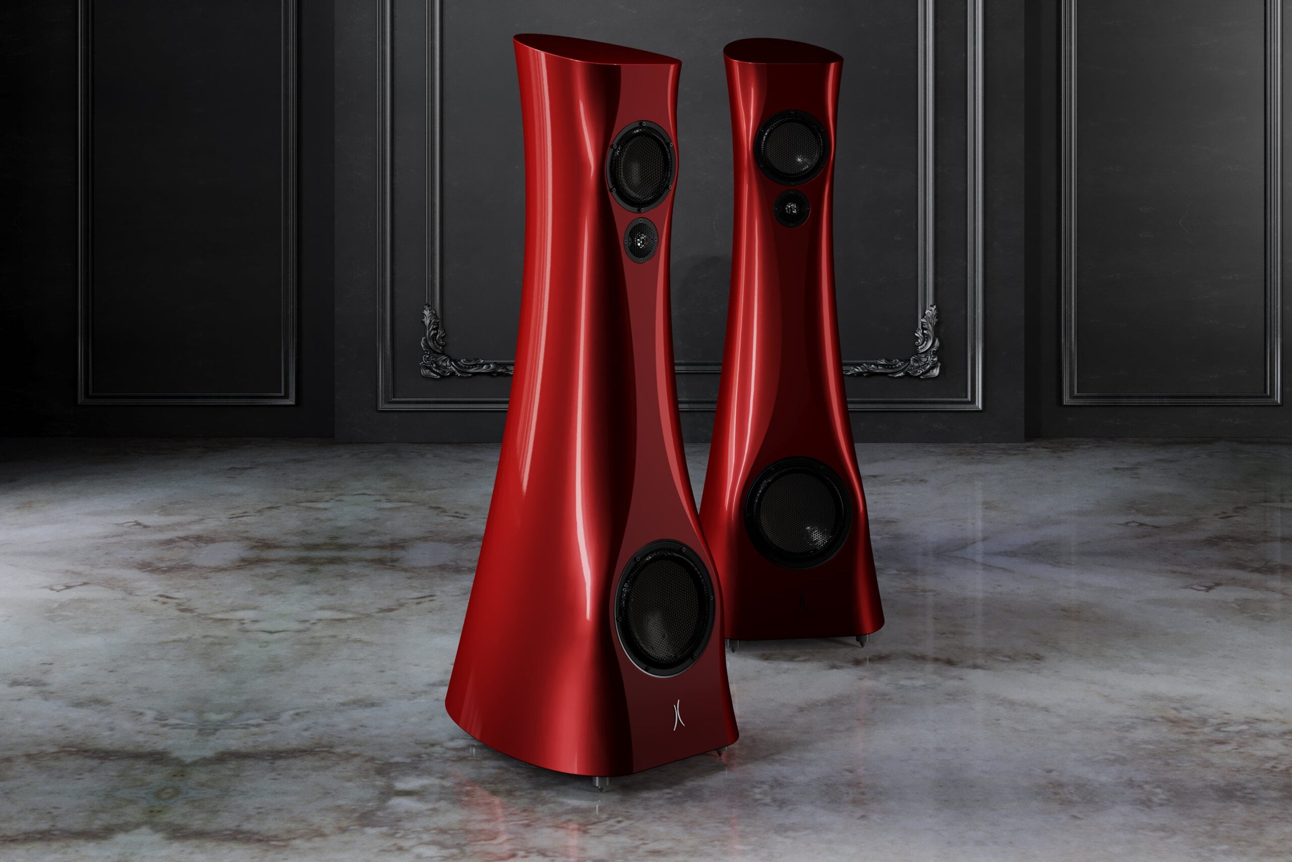 A pair of Red Rocket Liquid Gloss Estelon XB Diamond MK II floor-standing speakers with a diamond tweeter and a mid-woofer. in an upscale living room.
