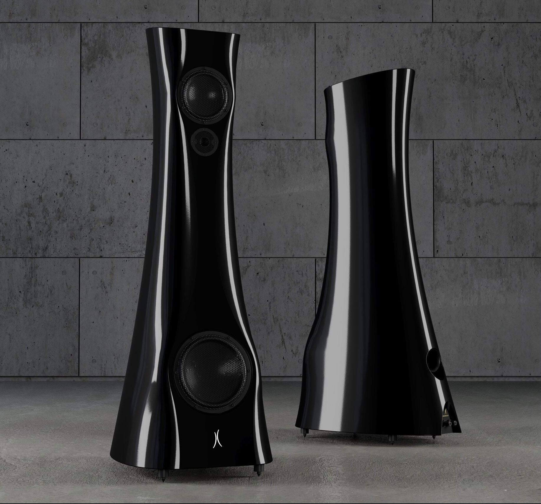 A pair of Black Lava Liquid Gloss Estelon XB MK II reference speakers with a curved-sculptural design, standing in an industrial environment.