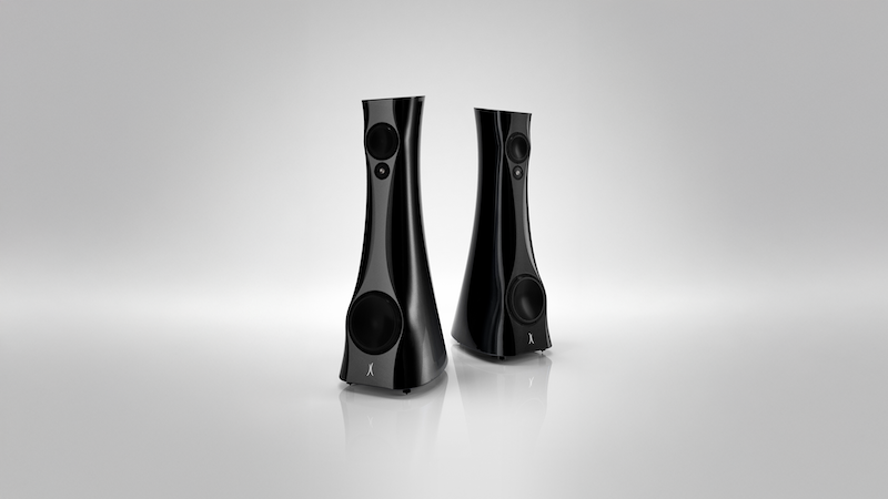 Two black Estelon X Diamond MK II Reference speakers on a reflective gray surface with a light gray background.