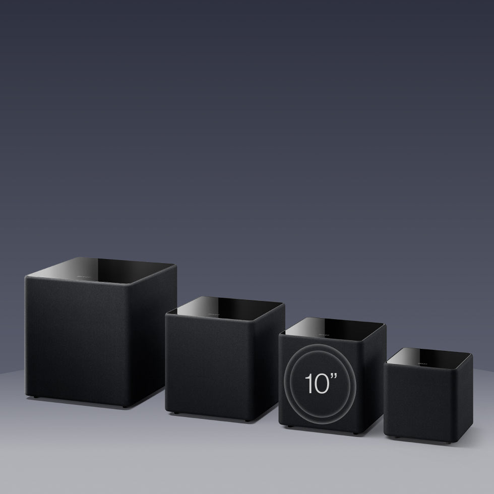 A llineup of different sizes of KEF KUBE MIE Subwoofers.