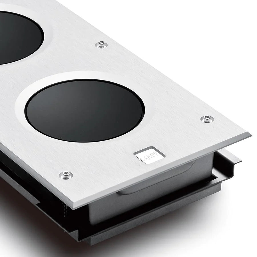 A closeup on a part of a KEF Ci3160RLB-THX In-Wal Subwoofer - HiFi Centre.