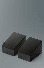 Two black KEF Q8 Meta Atmos Speakers on a gray background