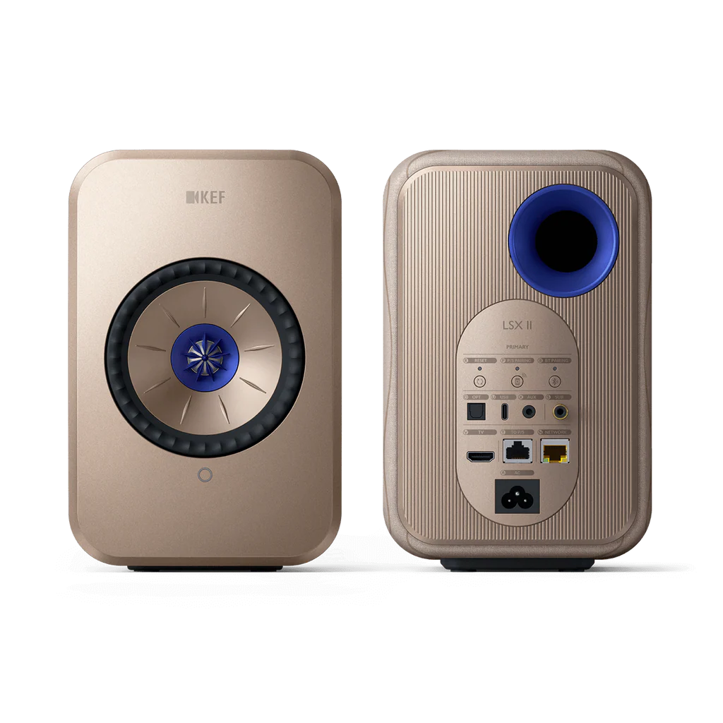 Two gold KEF speakers on a white background