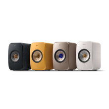 Four KEF speakers in black, yellow, beige, and white on a white background