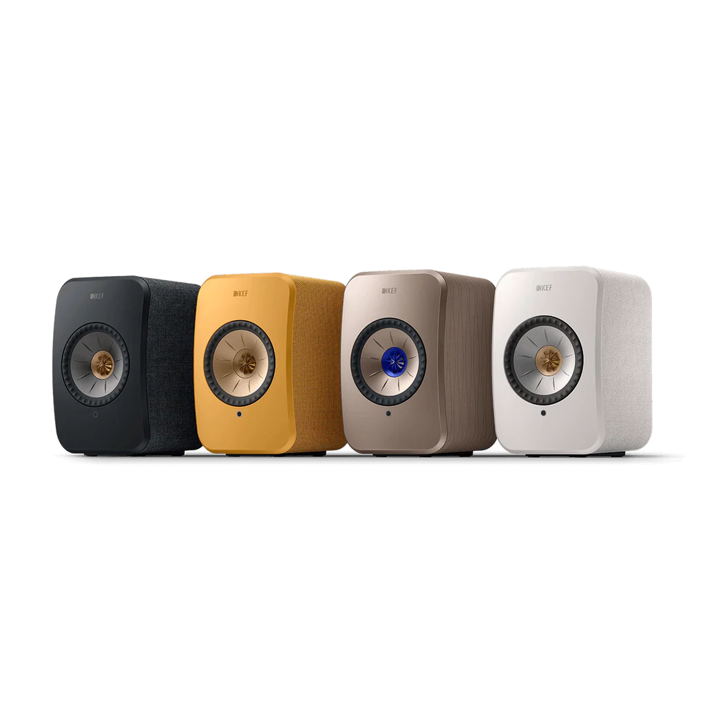 Four KEF speakers in black, yellow, beige, and white on a white background