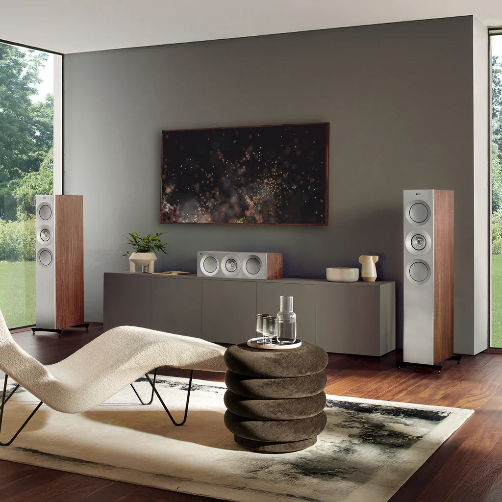 Modern living room with audio equipment, including KEF Reference 3 Meta
 speakers and a sound system.