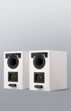 The back side of a pair of white KEF Q3 Meta Bookshelf Speakers.