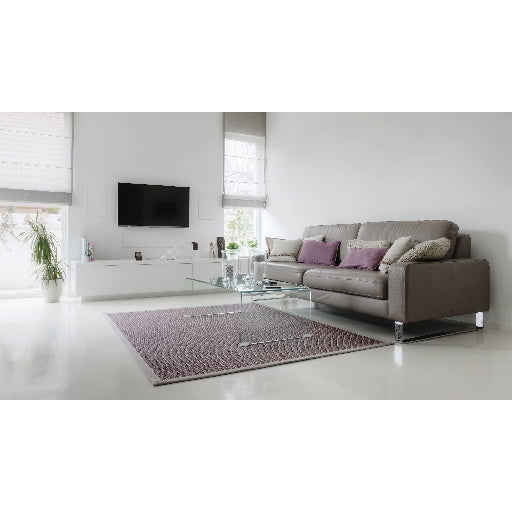 A modern living room with a pair of B&W CWM664 In-Wall Speakers