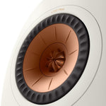 A closeup on A pair of KEF LS50META black bookshelf speaker's copper dome tweeter.
